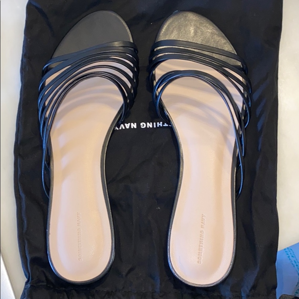 Something Navy black leather strappy slides